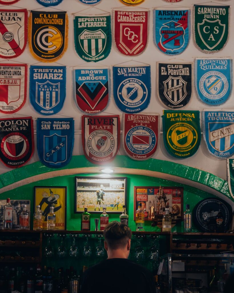 Football fans watching a match in a pub