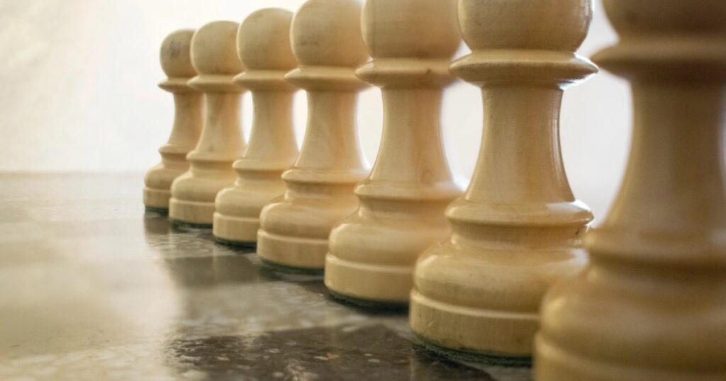 Chess pieces on a board representing business strategy and risk